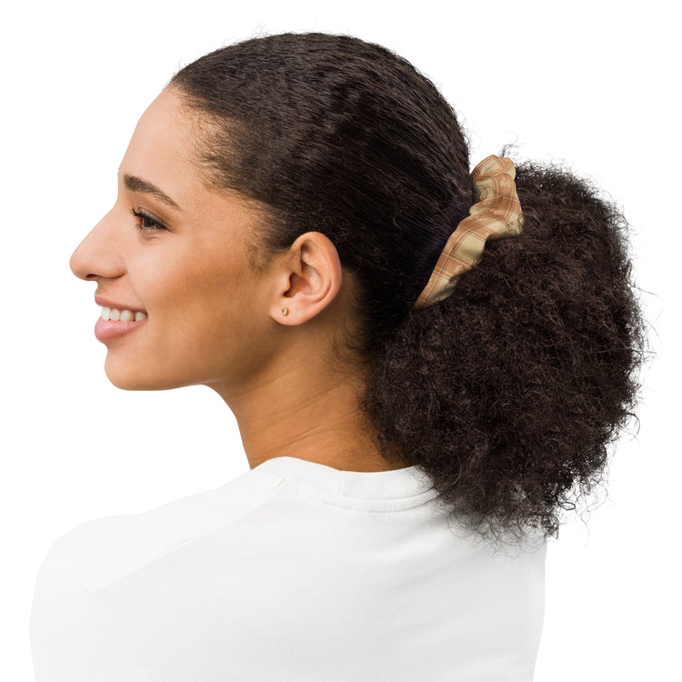 Woman with a ponytail featuring a scrunchie on a white background