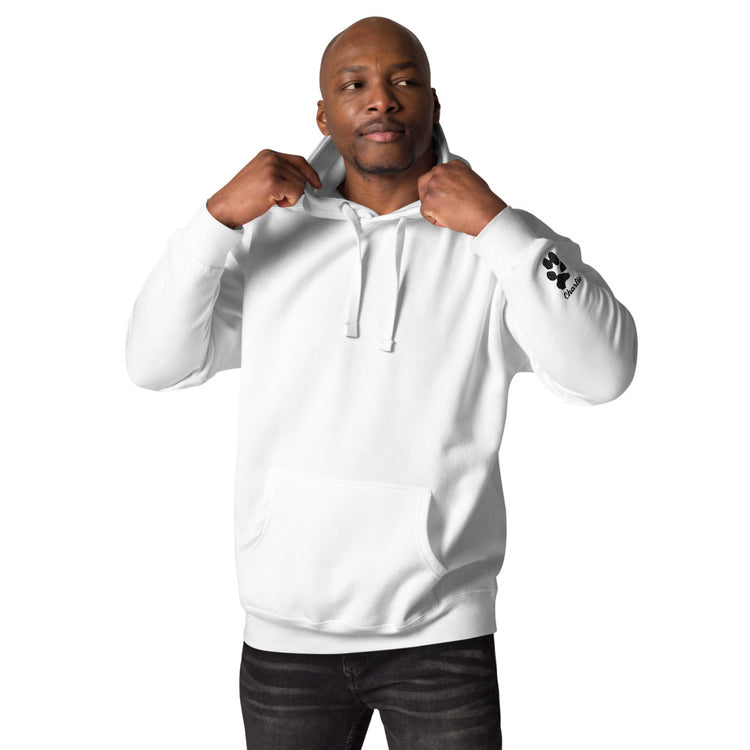 Man wearing a white hoodie with a logo on the sleeve against a white background