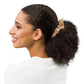 Woman with a ponytail featuring a scrunchie on a white background